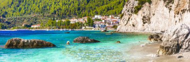 Best of Skopelos island - picturesque village Neo Klima and Hovolos beach.Greece. clipart