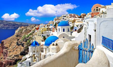 Iconic Santorini - most beautiful island in Europe. view with traditional churches in Oia village. Greece clipart