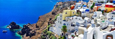 Iconic Santorini - most beautiful island in Europe. view of caldera and Oia village. Greece clipart