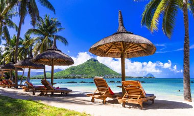 Relaxing holidays in tropical paradise. Mauritius island. Flic en Flac beach clipart