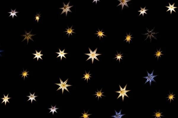 Estrelas de Natal em um fundo escuro — Fotografia de Stock