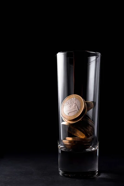 Glass for alcohol with Euro coins — Stock Photo, Image