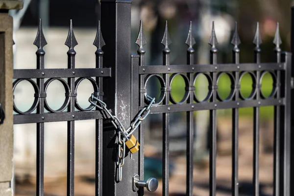 Gate to the lock with a chain