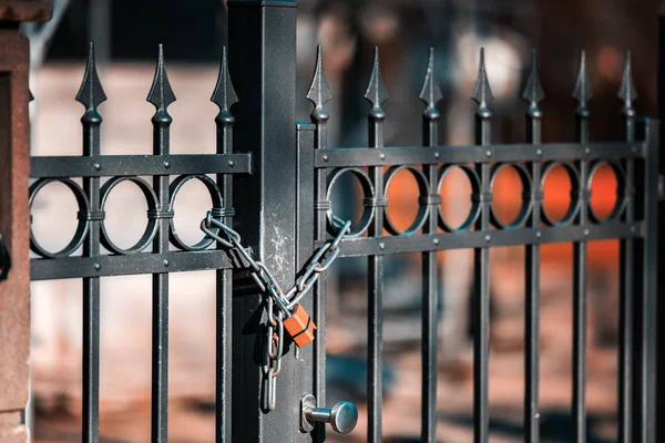 Gate to the lock with a chain