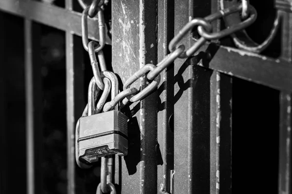 Gate to the lock with a chain