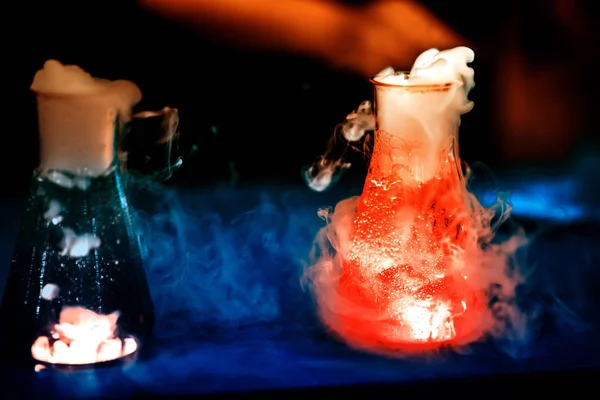 Glass flasks with chemical reaction