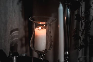 White candle on the dining table