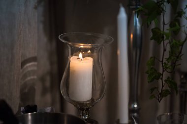 White candle on the dining table