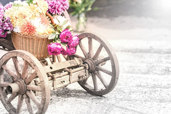 Wooden cart with flowers