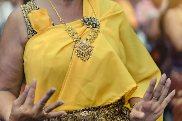 Beautiful Thai women in Thai traditional costume perform Thai dance during in Songkran festival.