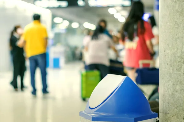 Blue cover transparent trashcan for increasing safety measures placed on the floor in the airport. — Stock Photo, Image