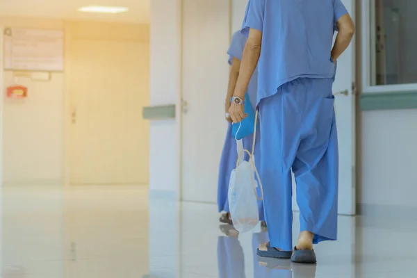 Male urinary tract patients walking for exercise and rest in the hospital — Stock Photo, Image