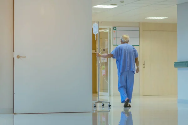 Male urinary tract patients walking for exercise and rest in the hospital — Stock Photo, Image