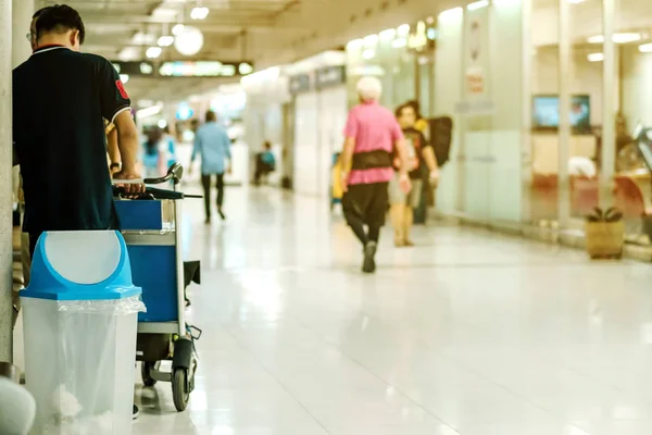 Blue cover transparent trashcan for increasing safety measures placed on the floor in the airport. — Stock Photo, Image