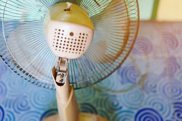 Close up to the old plastic joints of the electronic fan damaged and broken with a blurred background. Selective focus