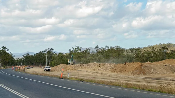 Road works to construct another lane on a bitumen highway in Queensland Australia