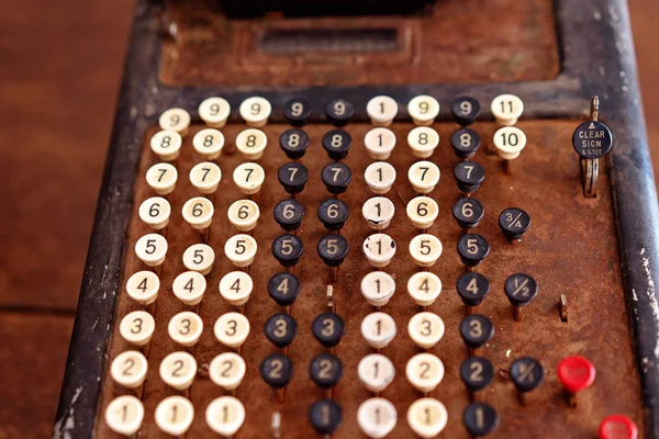 Vintage calculator used for adding numbers in the old days of yesteryear