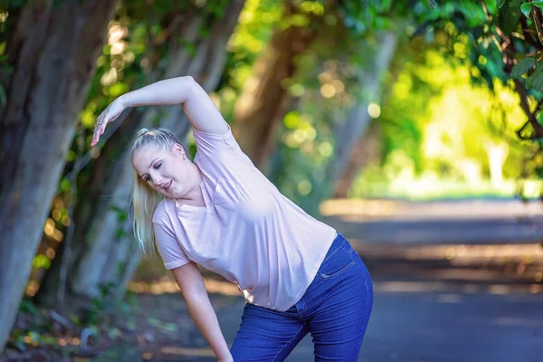 Healthy young lady exercising in park to lose weight and improve her lifestyle