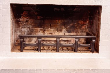 A Fireplace Surrounded By White Bricks clipart