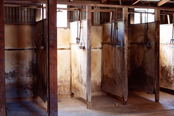 Squalid Shower Stalls Used By Gold Miners — Stockfoto