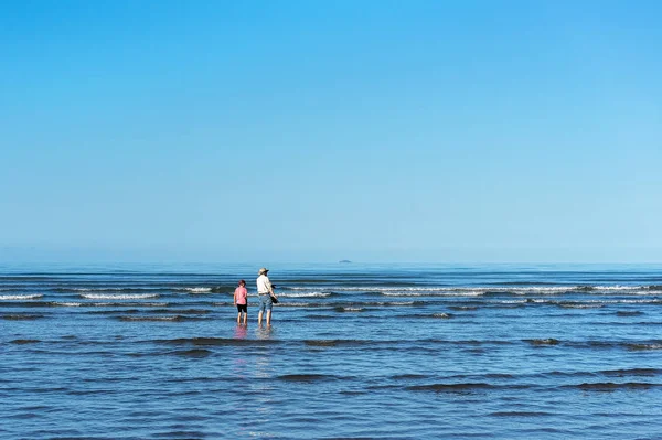 Grandfather And Grandson Paddling In The Ocean — Stock Photo, Image