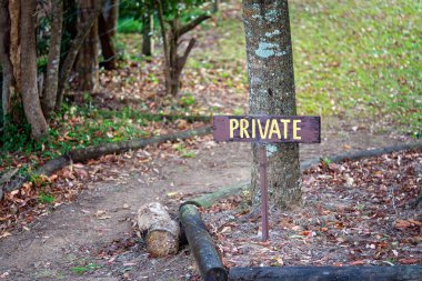 Private Keep Out Sign In A Garden clipart