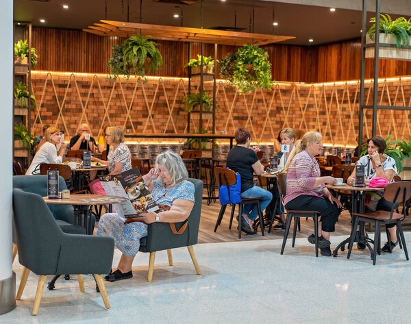Women Dining At A Shopping Centre Cafe