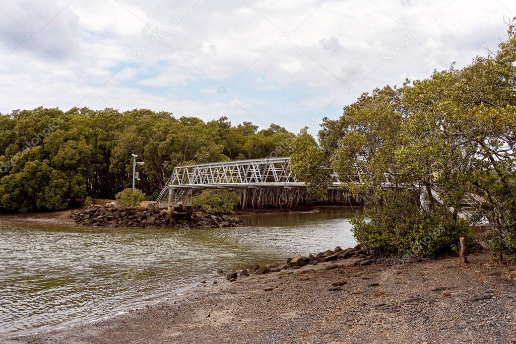 Steel Bridge Over A Muddy Creek