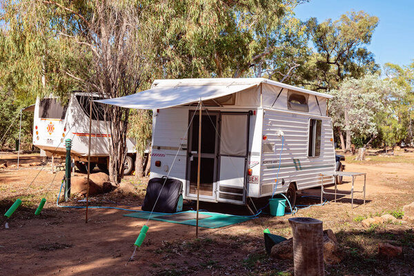 Undara Volcanic National Park, Queensland, Australia - June 2020: Holidaymakers set up their caravan in the park ready to tour the lava tubes