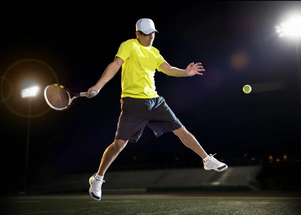 Tennis player at night — Stock Photo, Image