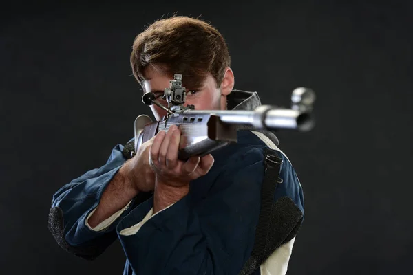 Young Man holding a gun — Stock Photo, Image