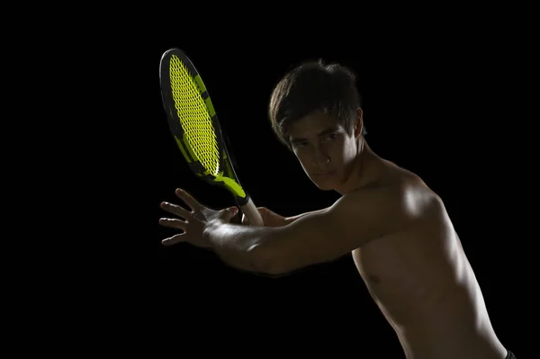 Jonge tennisspeler klaar voor een racket Stockfoto