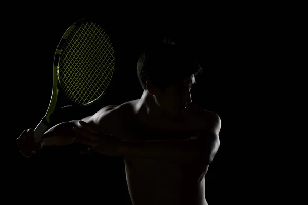 Jugador joven de tenis listo para cambiar de raqueta Imagen De Stock
