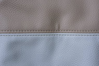 Bir torba bej ve beyaz deri, dişli, yatay görüntü parçası