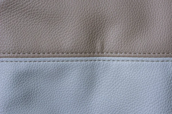 Bir torba bej ve beyaz deri, dişli, yatay görüntü parçası