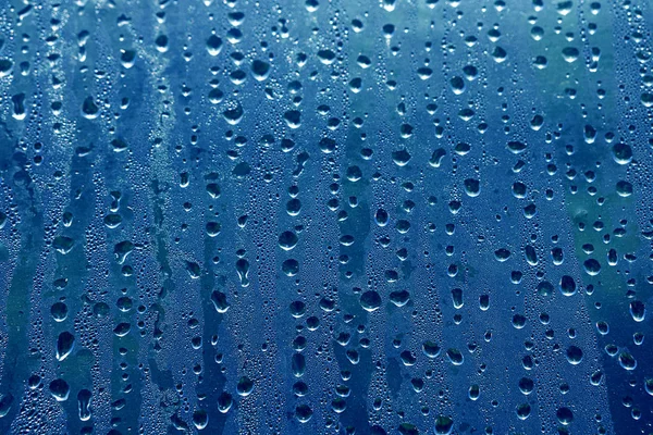 Μπλε Υφή Της Βροχής Πέφτει Στο Γυαλί — Φωτογραφία Αρχείου