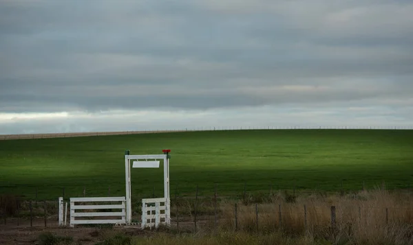 A farm gate in the argentinian pampas