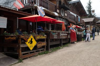 La Cumbrecita, Cordoba, Argentina - July 18 2019: It is an Alpine-style town founded in 1934 by German immigrants in the Calamuchita valley. The streets, tourism, pubs and restaurants. clipart