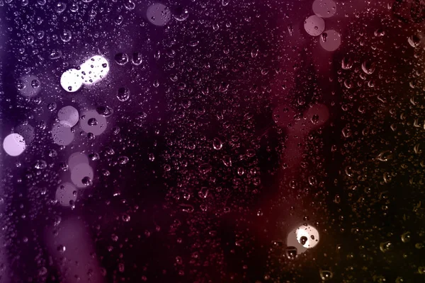 Tle Kolorowe Krople Deszczu Szybą Nocy Bokeh Światła Miasta — Zdjęcie stockowe