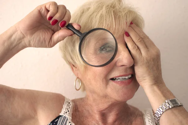 Smiling Senior Woman Vision Problems Magnifying Glass — Stock Photo, Image