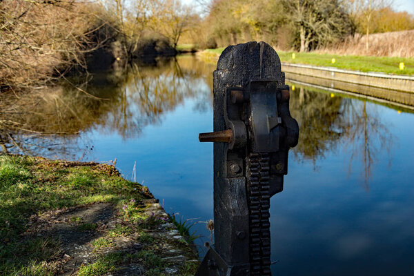 Feakes Lock on the Stort and Lee Navigation or canal between Harlow and Sawbridgeworth in Hertfordshire. With a rack gear mechanism and lock to  stop the rack dropping and closing the water gate.
