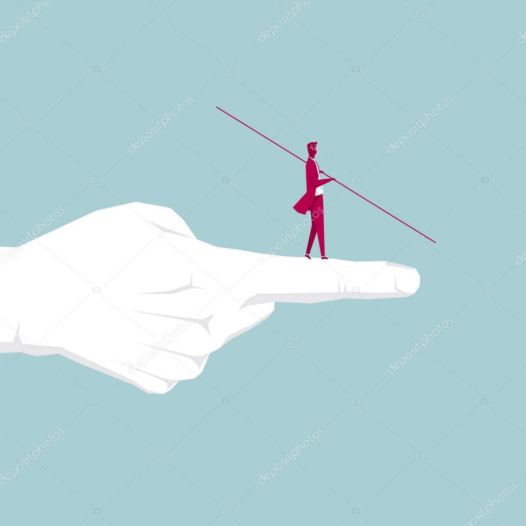 Businessman walking tightrope on the finger. Isolated on blue background.