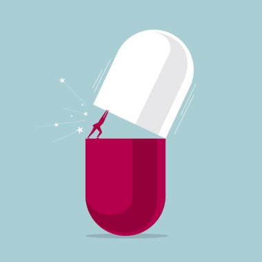 Büyük bir kapsül pill bir işadamı tarafından açıldı. Üzerinde mavi arka plan izole.