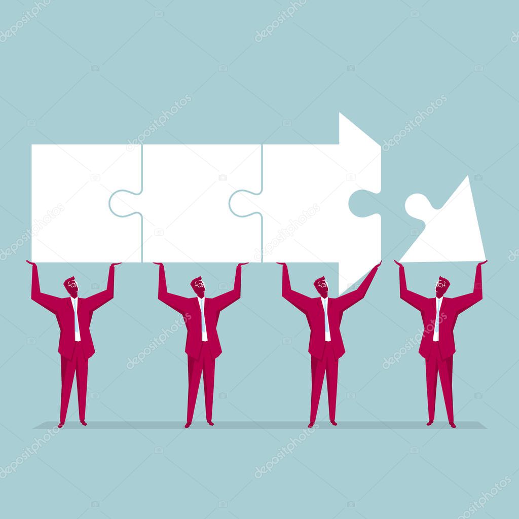 Teamwork concept. A group of businessmen lifted the arrow puzzle. Isolated on blue background.
