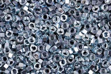 Altıgen metal fındık. Dokulu arka plan görüntüsü.