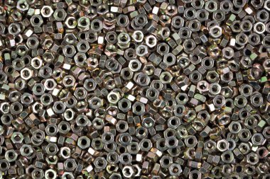 Altıgen metal fındık. Dokulu arka plan görüntüsü.