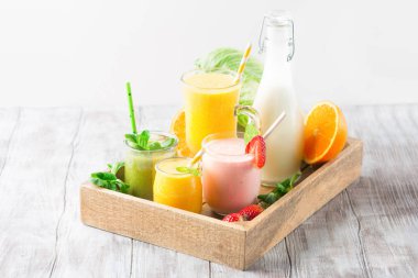 Detox diet concept: fresh smoothie on table clipart