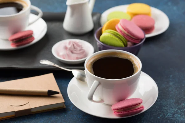 Two cups of coffee and sweets on table — Stock Photo, Image