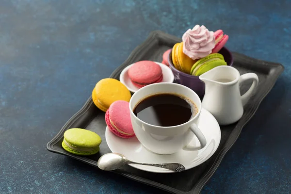 Cup of coffee and sweets on table — Stock Photo, Image