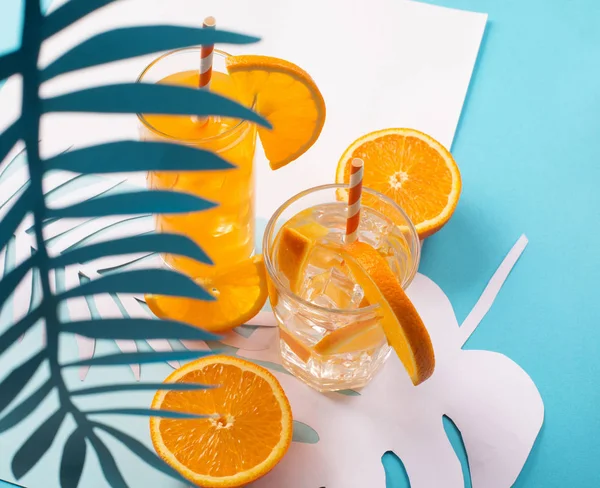 Orange juice in glass and fresh fruits — Stock Photo, Image